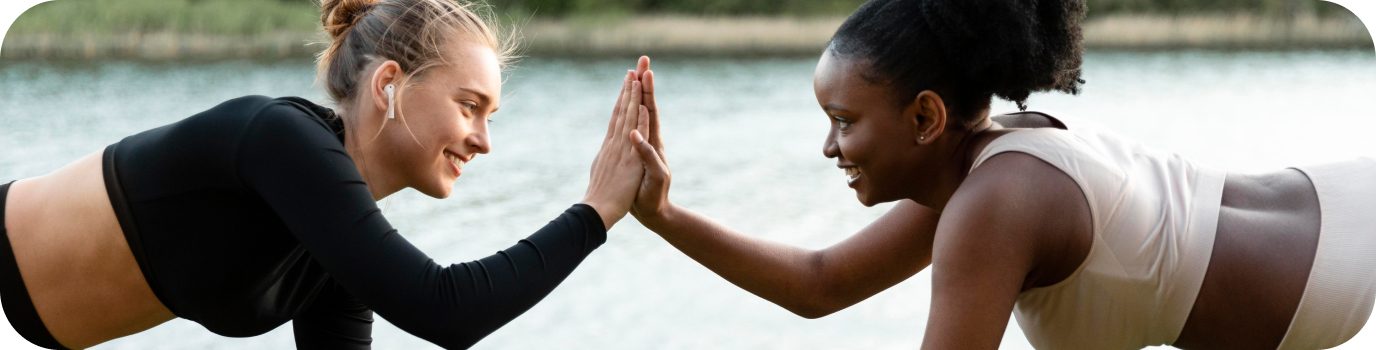 Two people high-fiving during a workout